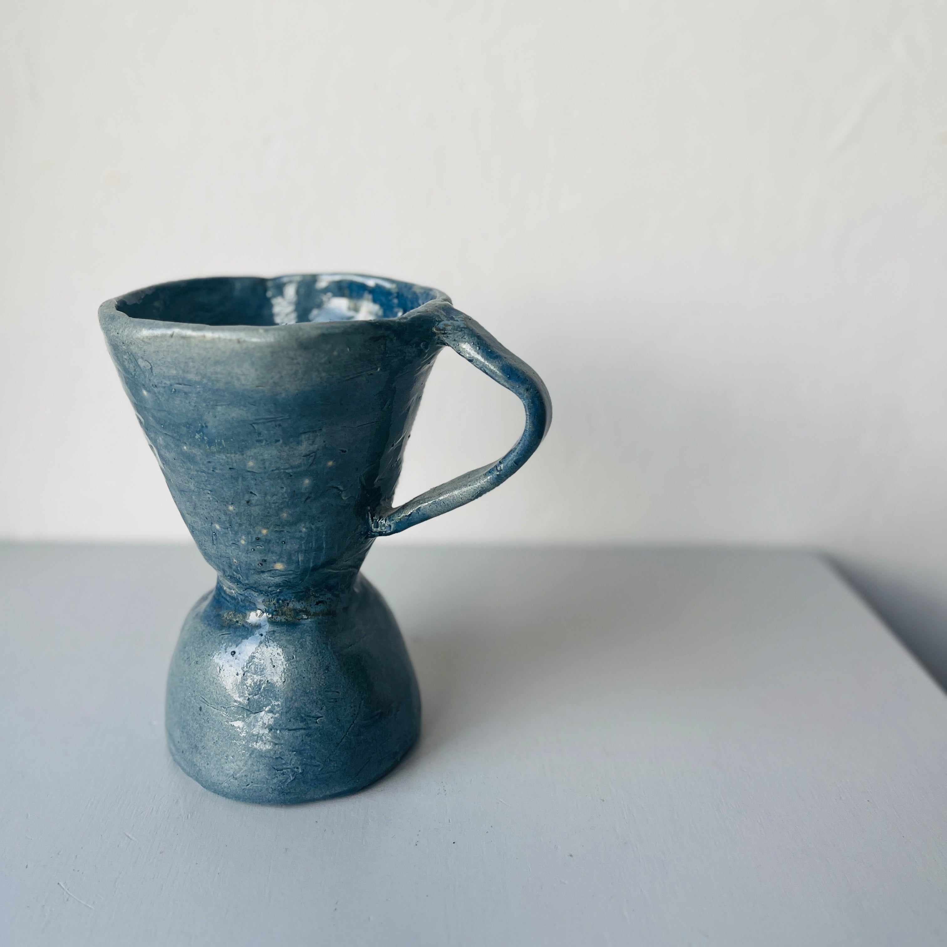Handmade ceramic vase with ear blue