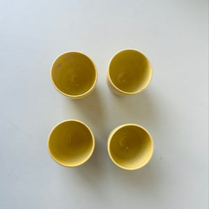 Set of 4 handmade ceramic butter yellow cups