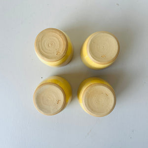 Set of 4 handmade ceramic butter yellow cups