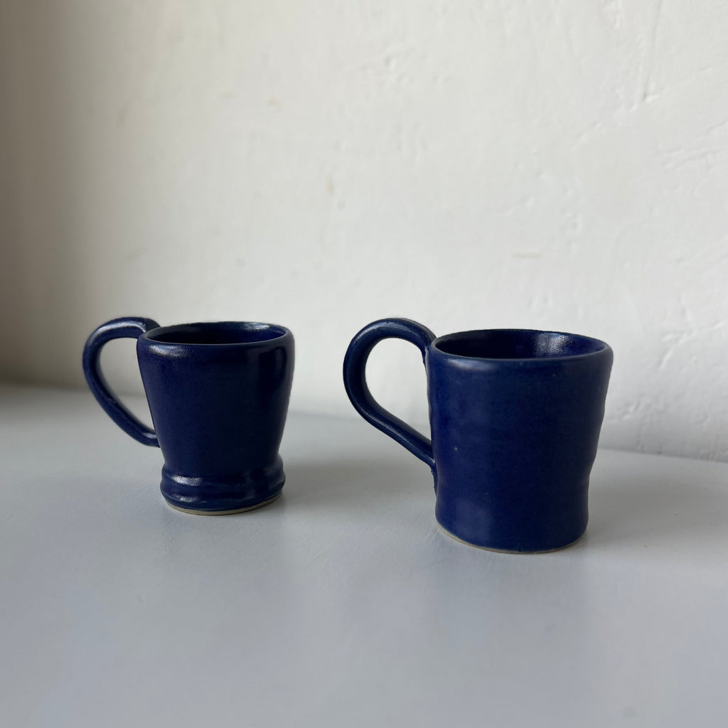 Two handmade ceramic mugs