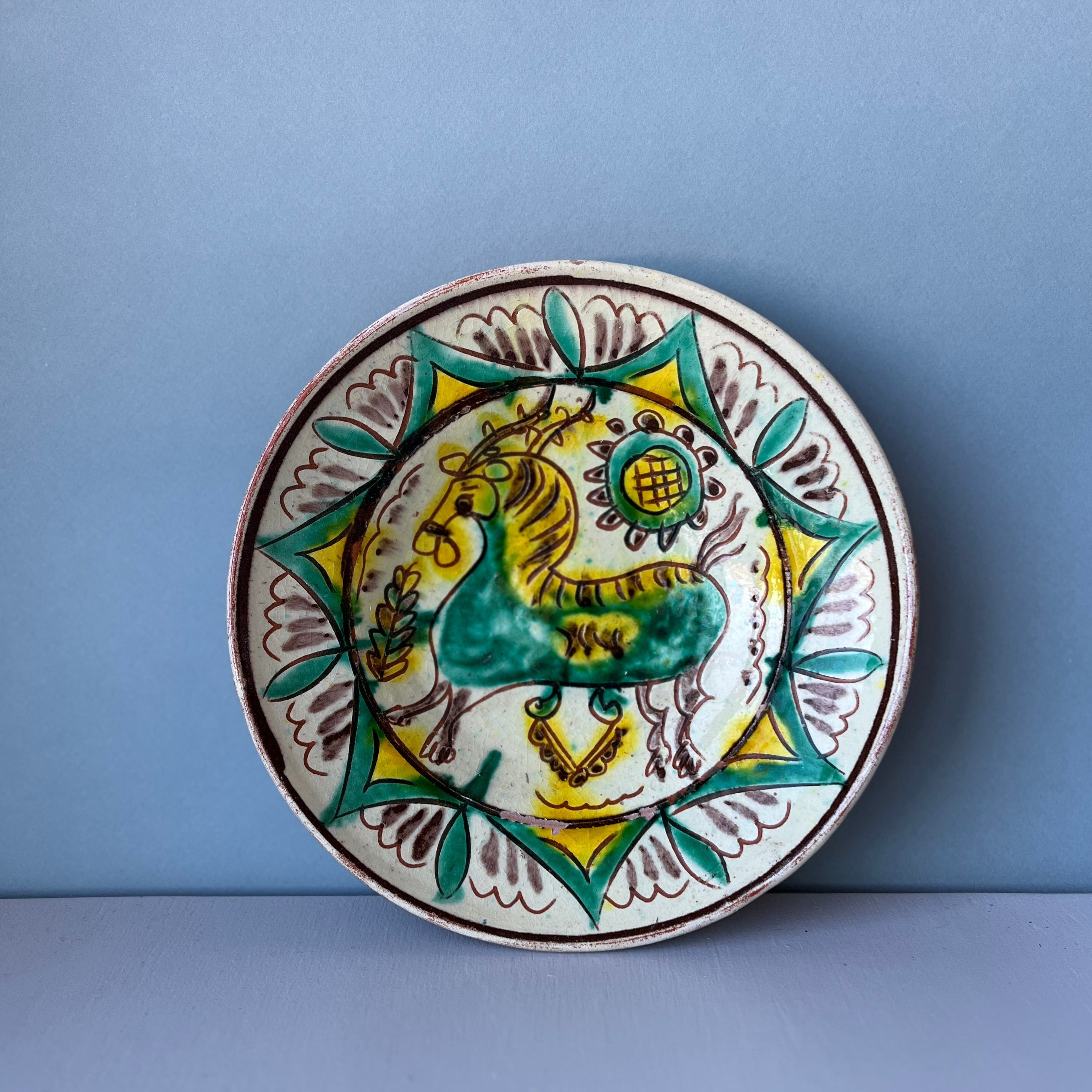 Vintage terracotta plate with horse