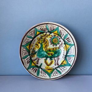 Vintage terracotta plate with horse