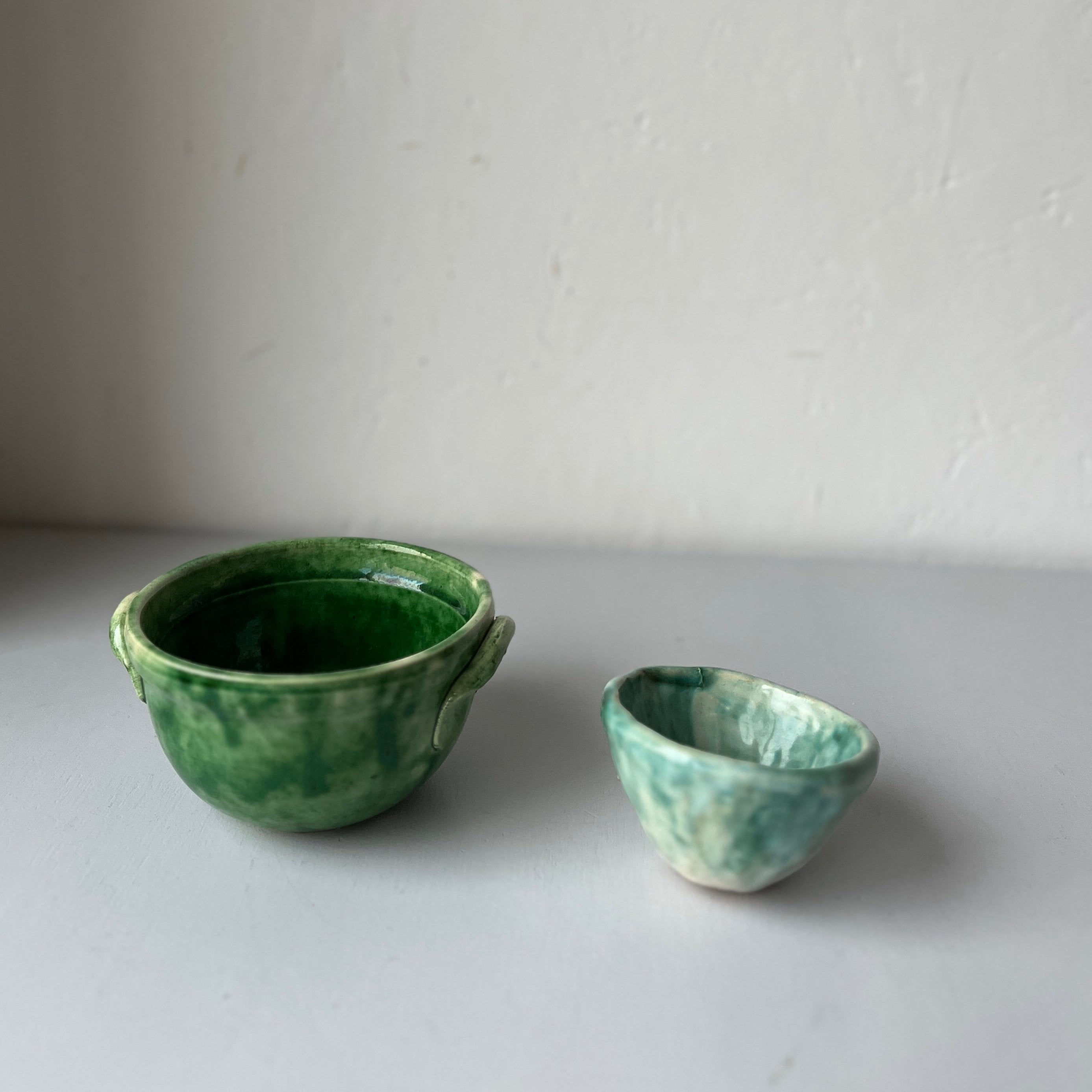 Set of green handmade bowls