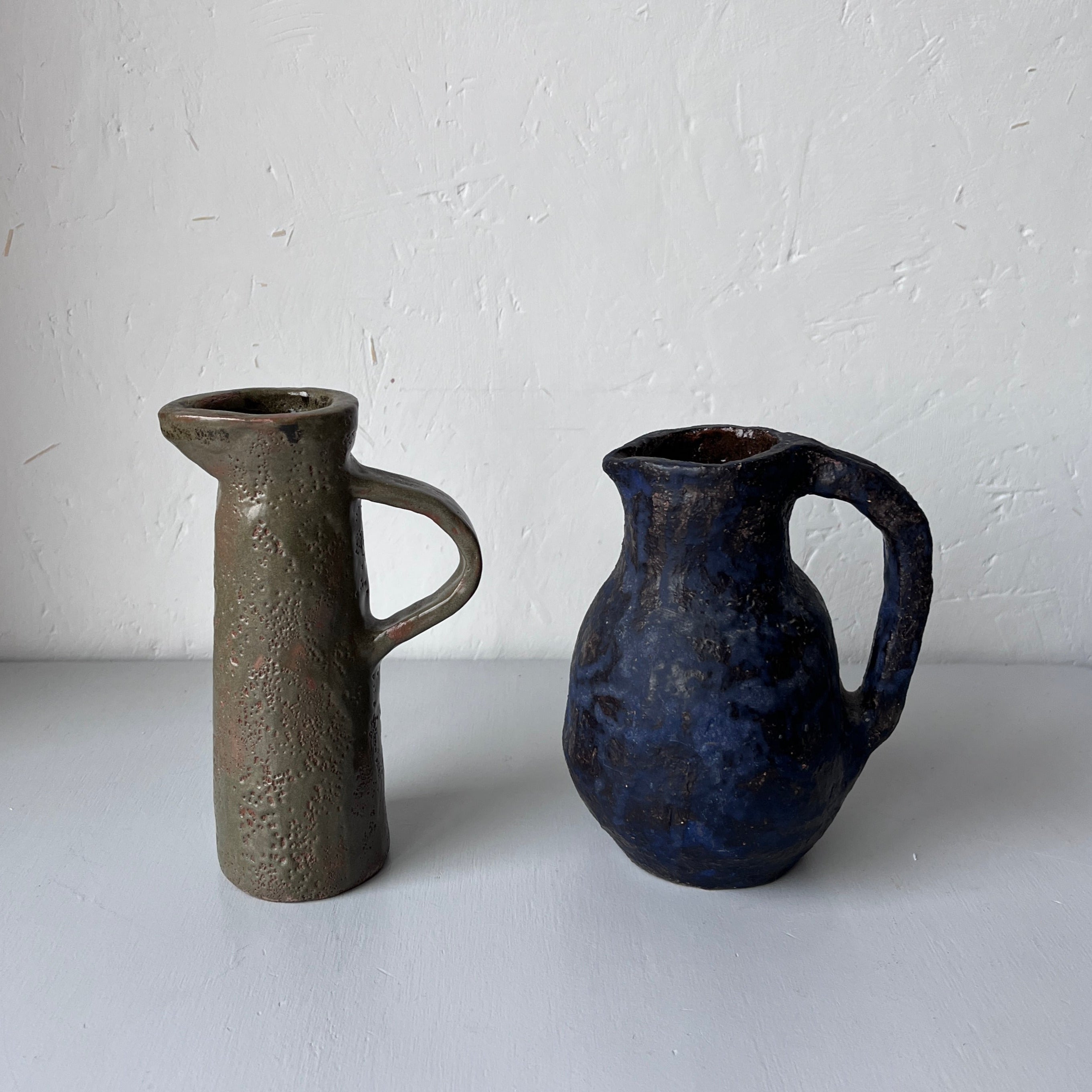 Two vintage ceramic jugs / vases