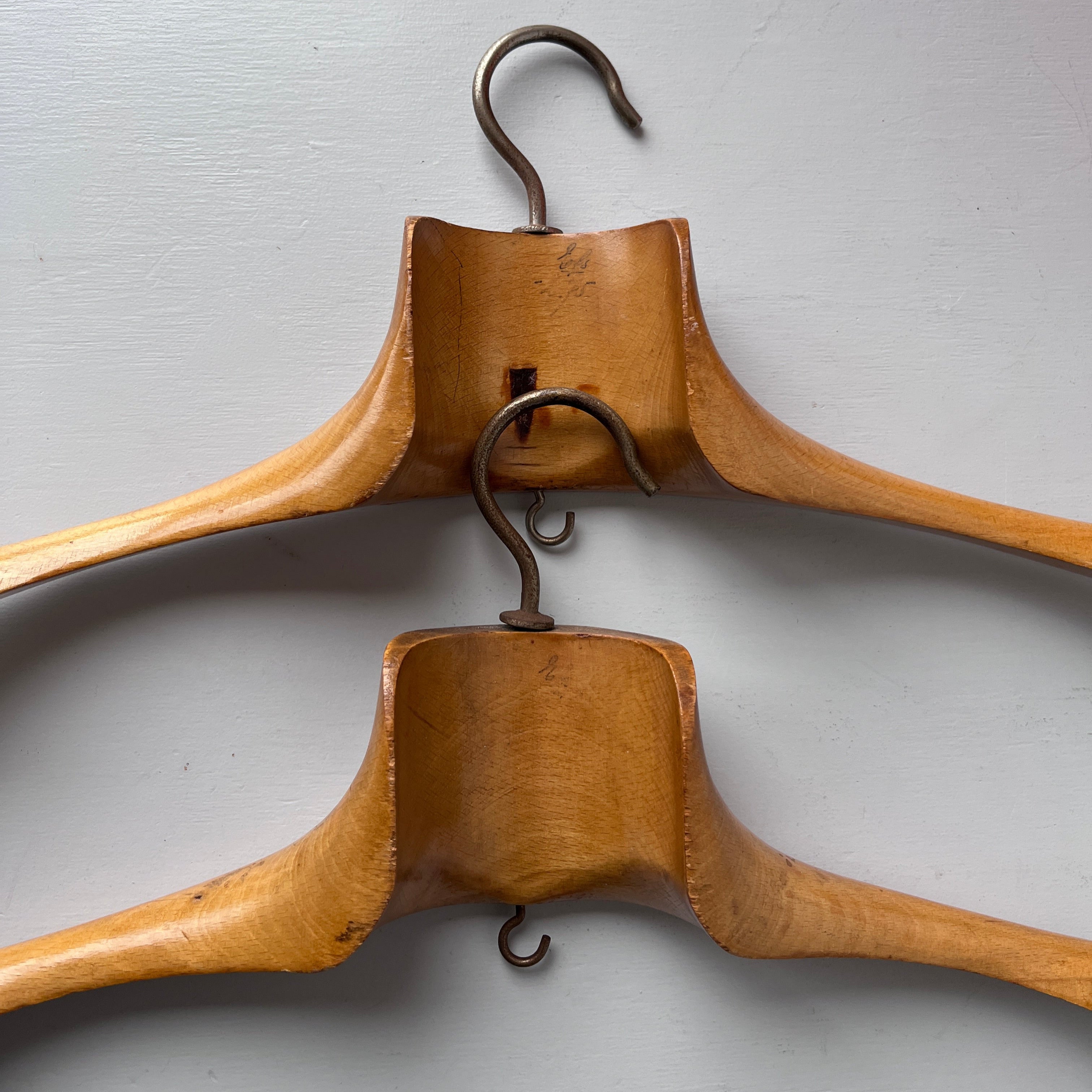 Two vintage wooden coat hangers