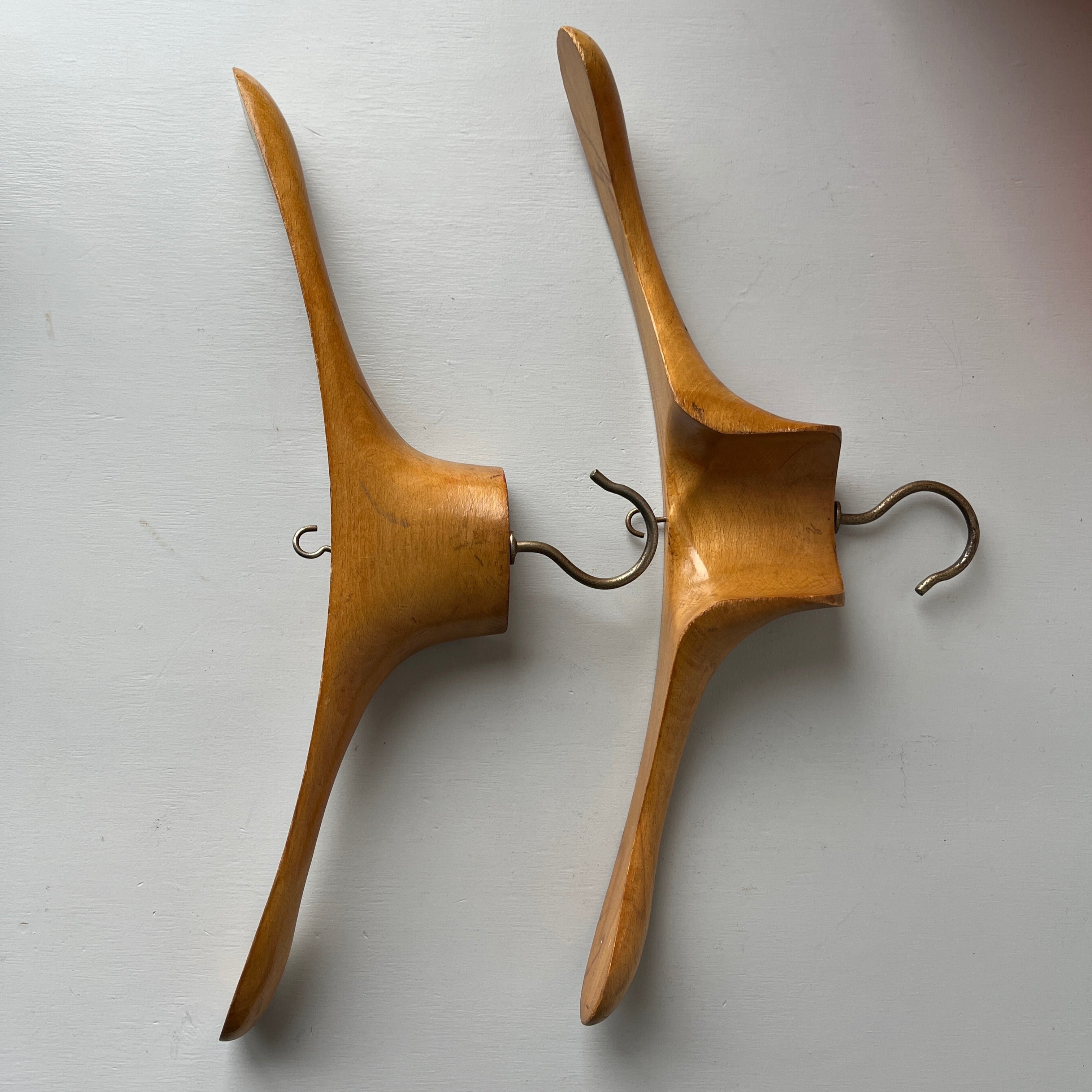 Two vintage wooden coat hangers