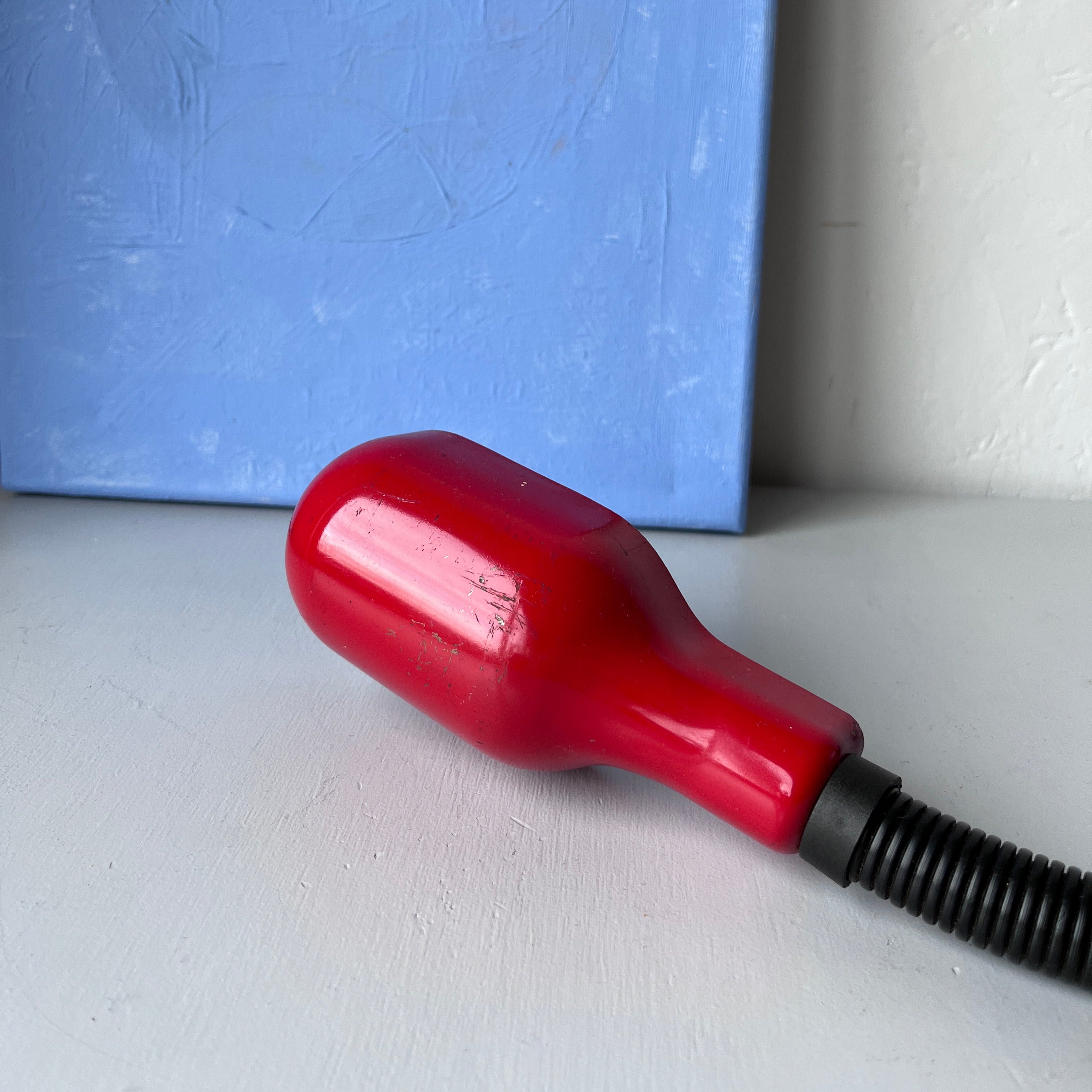 Vintage red squeeze lamp