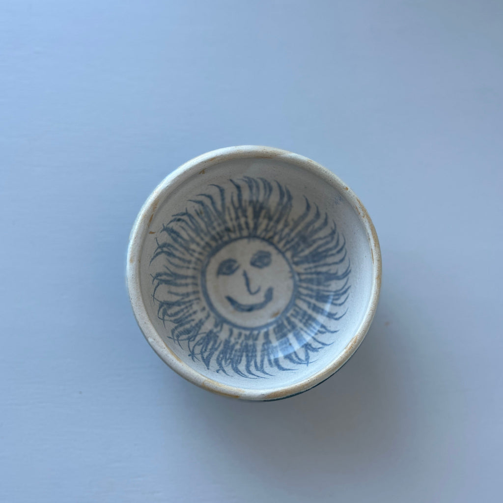 Little ceramic vintage bowl with sun