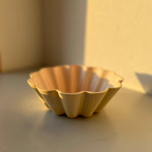 Handmade yellow ceramic bowl.