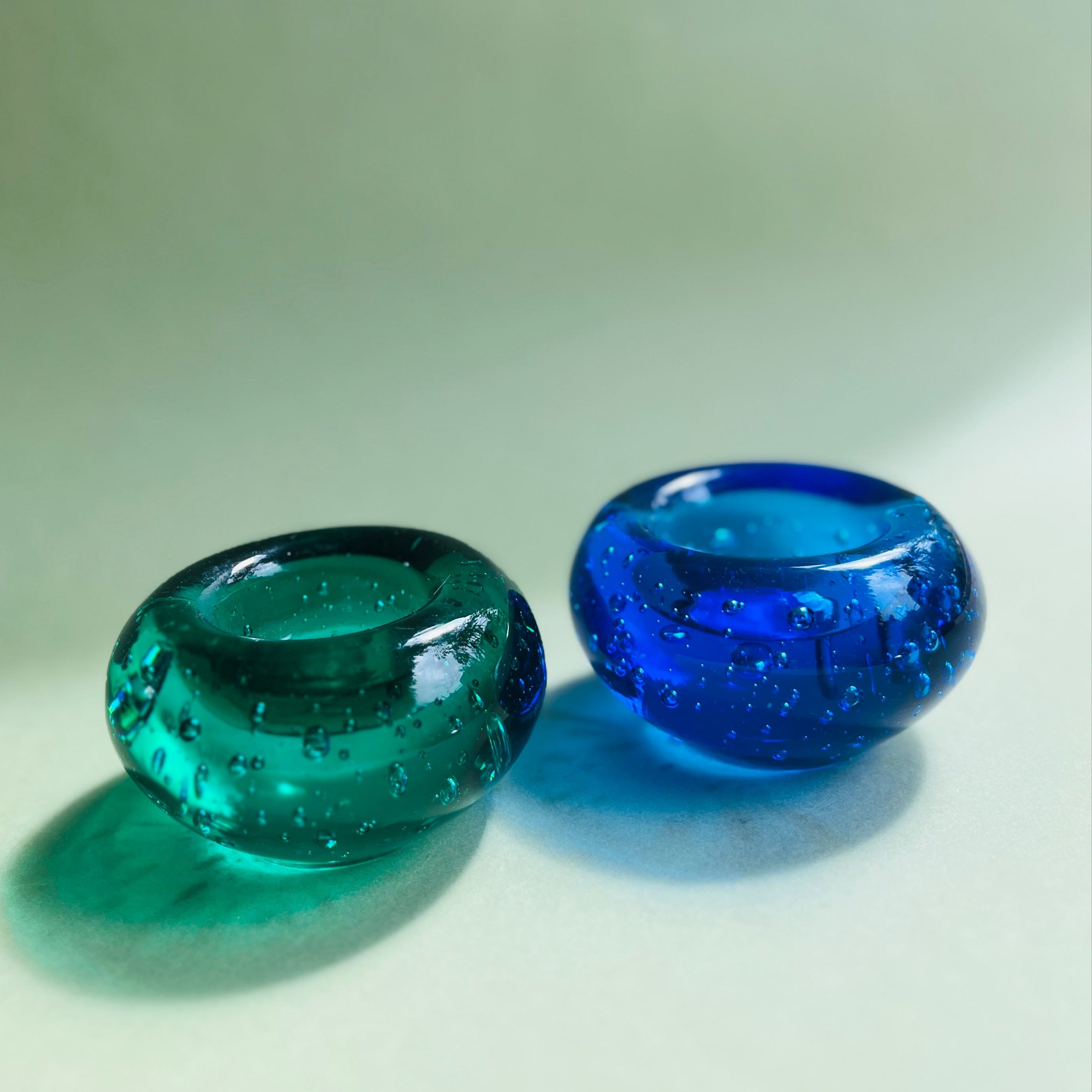 Set of two solid glass candle holders