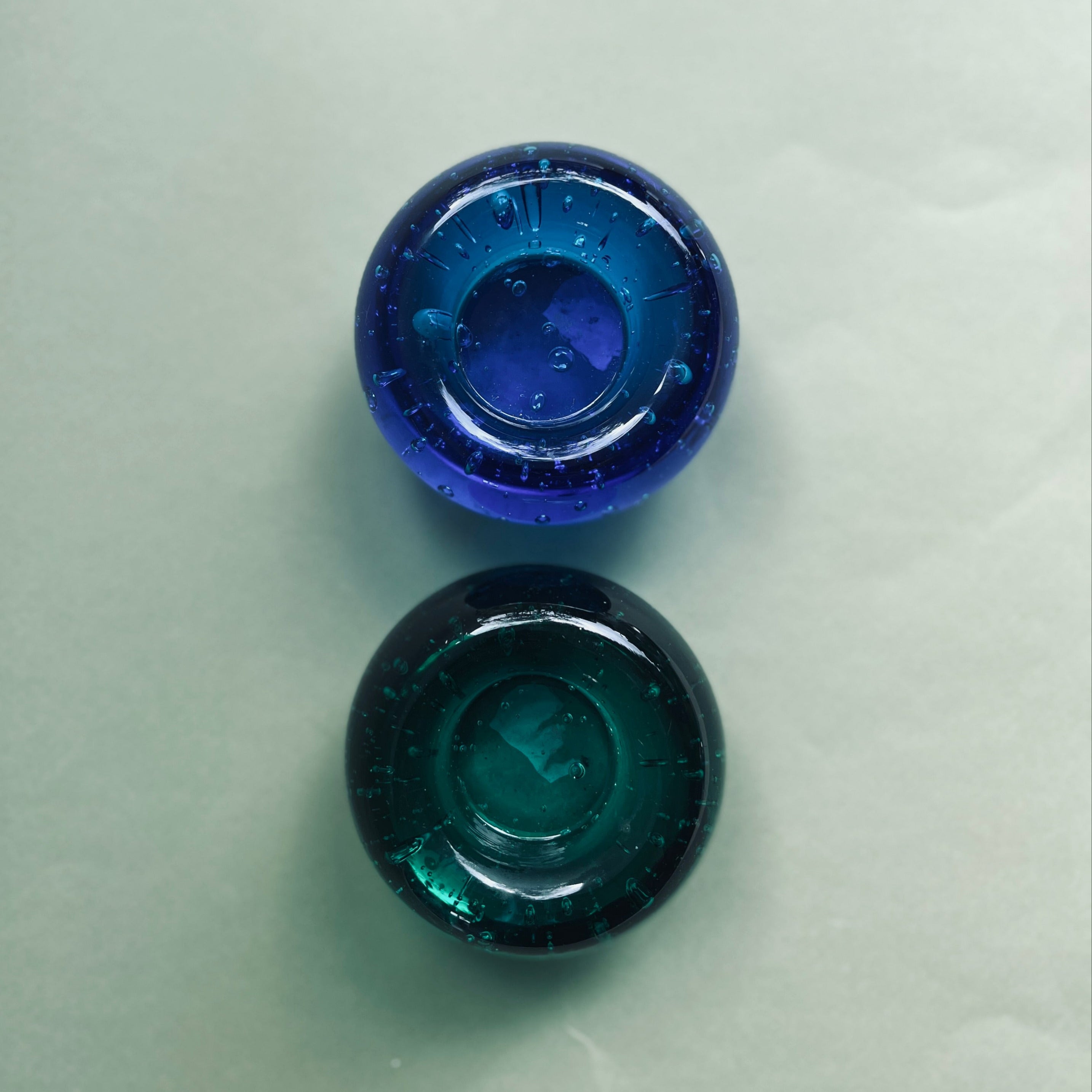 Set of two solid glass candle holders