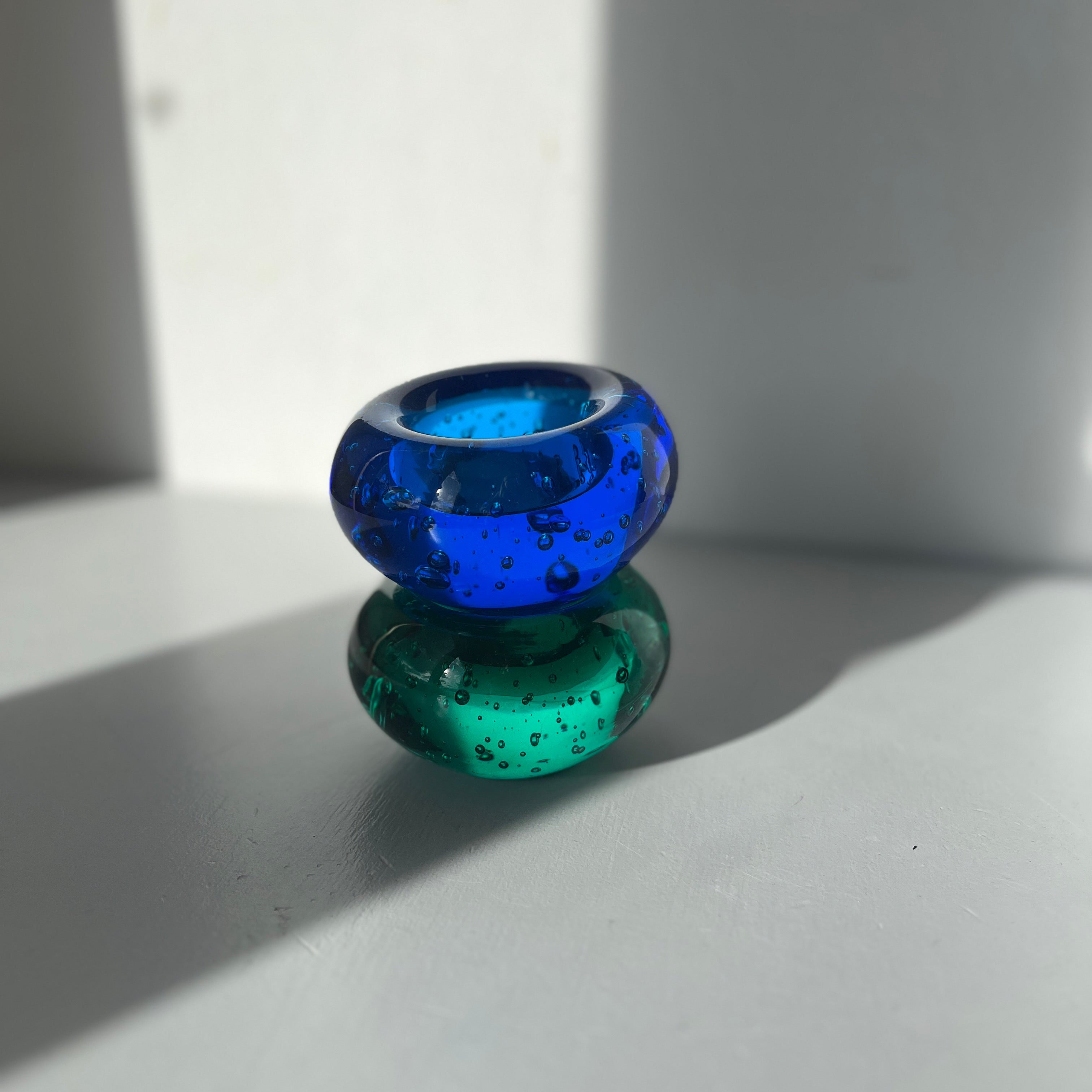 Set of two solid glass candle holders