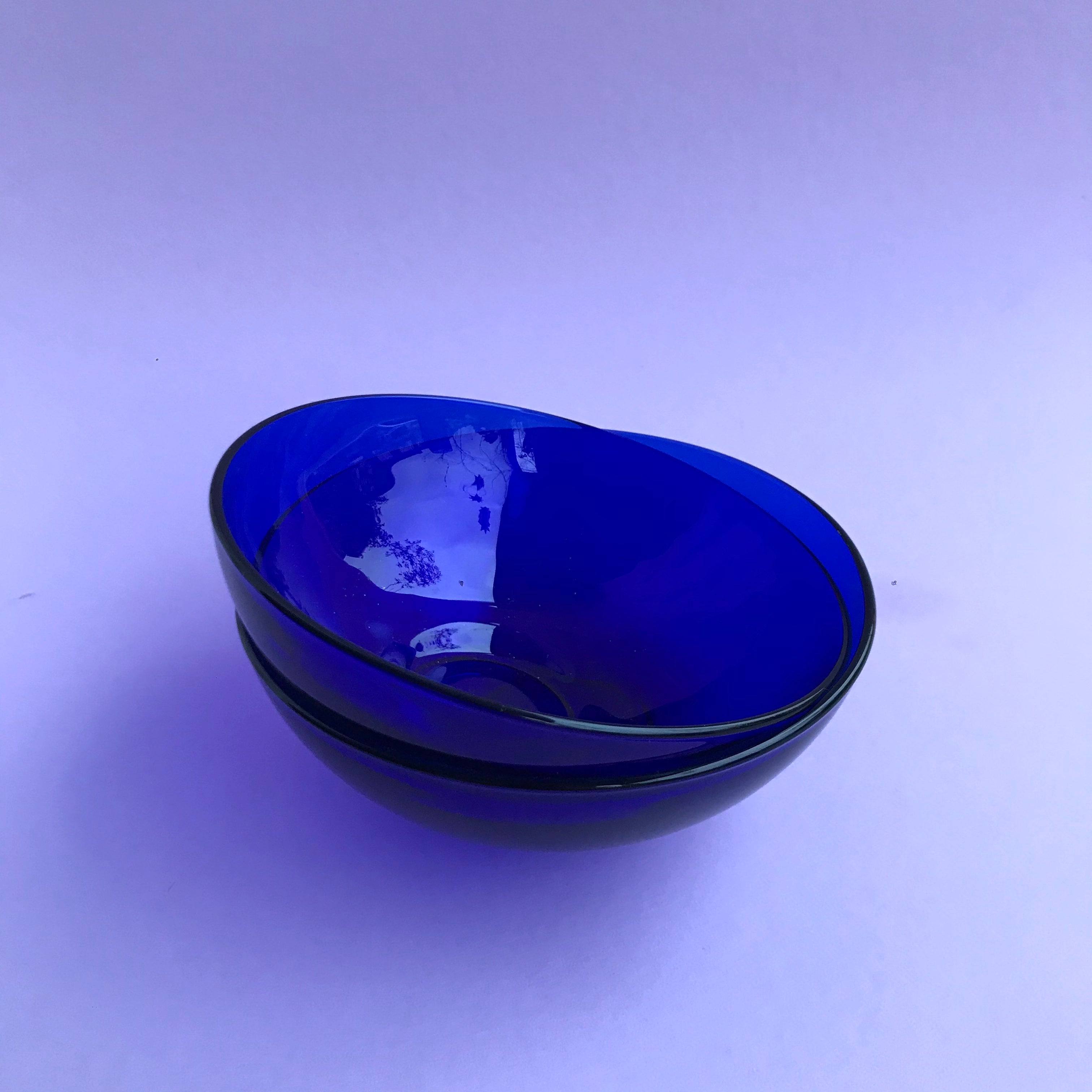 Two vintage blue glass bowls